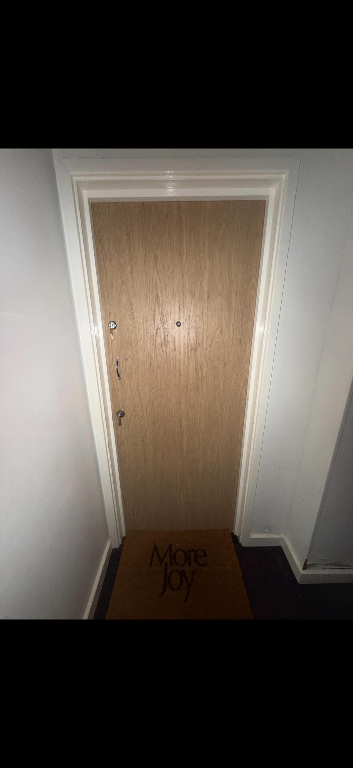 Wooden fire door white frame hallway