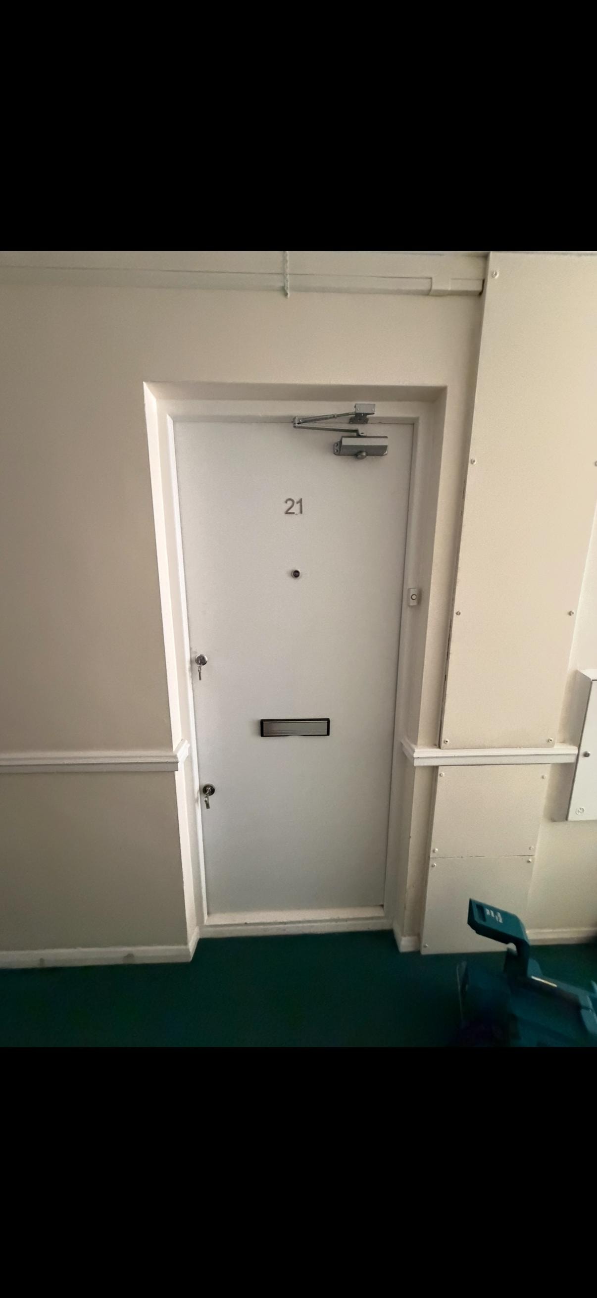 White apartment fire door number 21