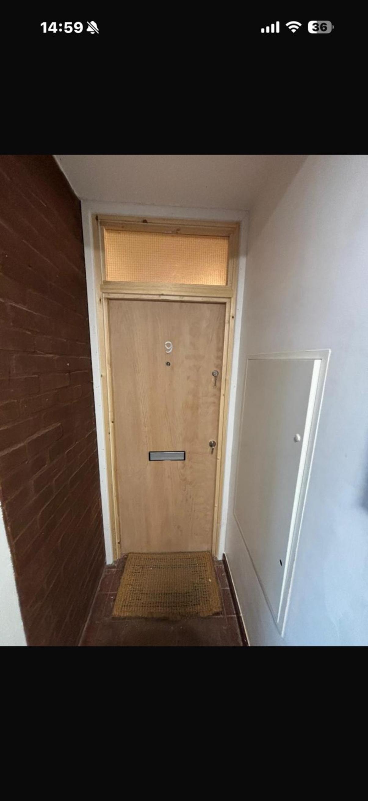 Apartment hallway with numbered fire door