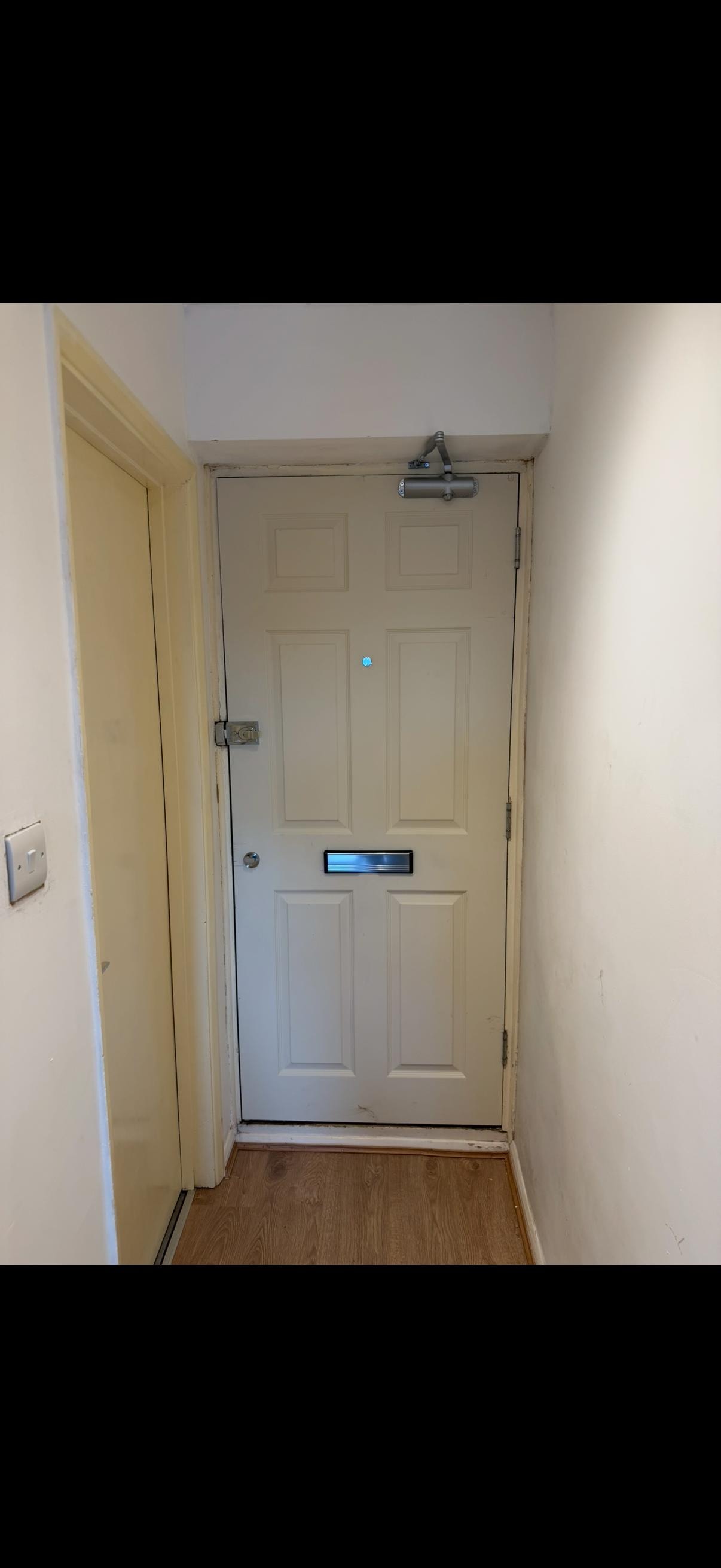 White panelled fire door entryway