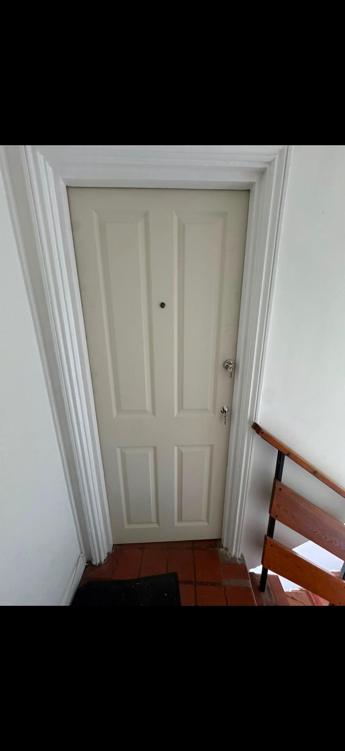 White six-panel fire door with white trim