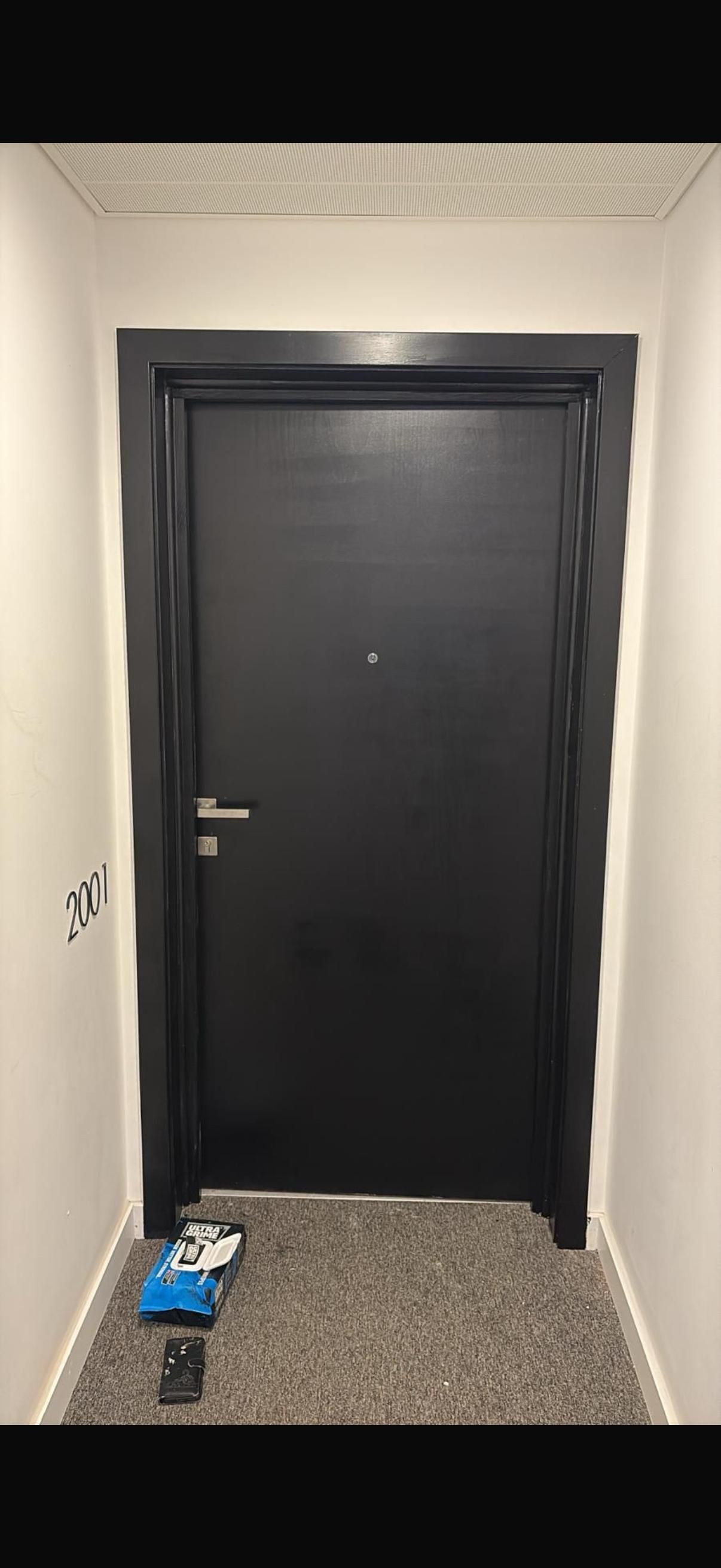 Black fire door apartment hallway entrance